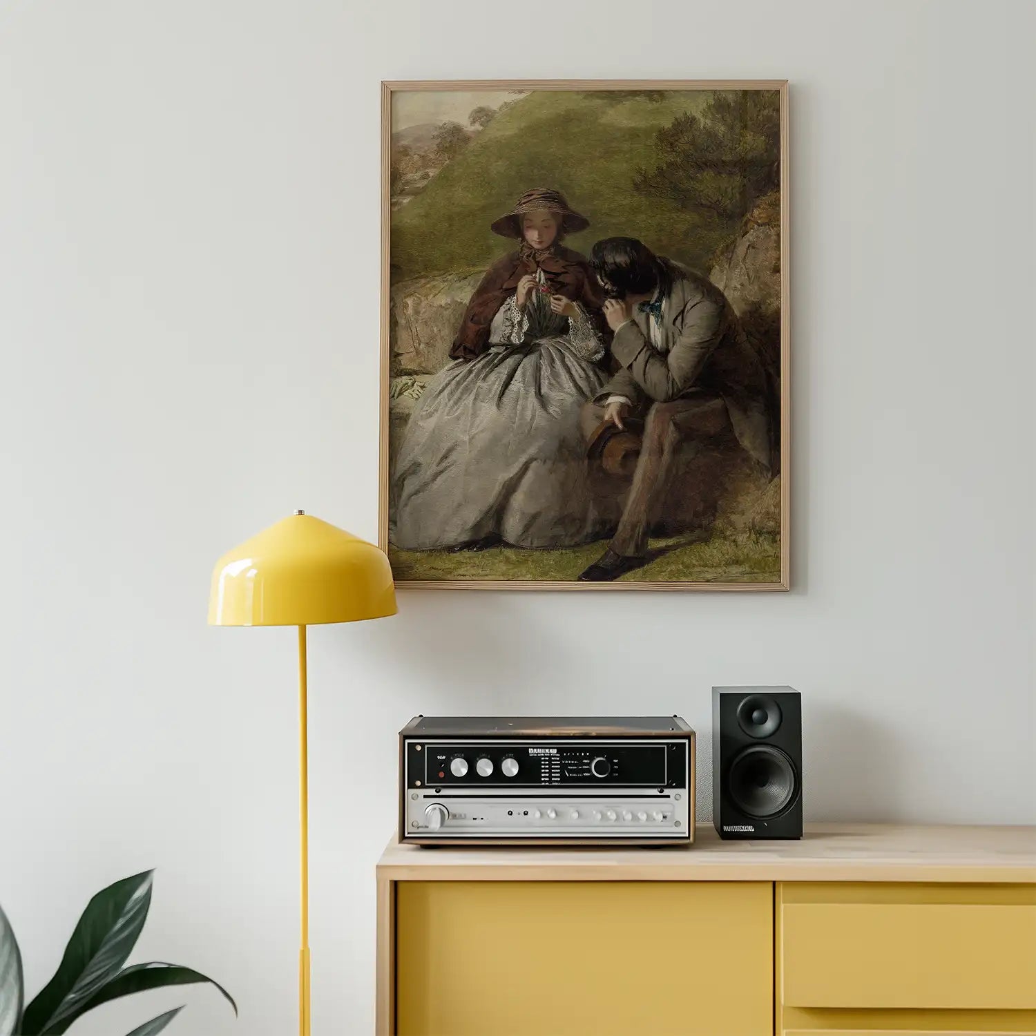 Painting of a man and woman seated outdoors, framed on a wall above a yellow lamp and a retro audio system.