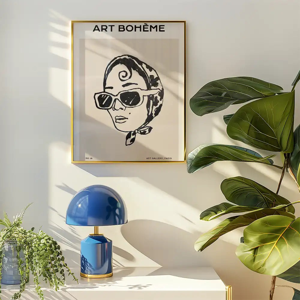 Modern poster featuring a stylish woman in sunglasses with a headscarf, framed in gold, titled "ART BOHÈME," perfect for contemporary home decor.