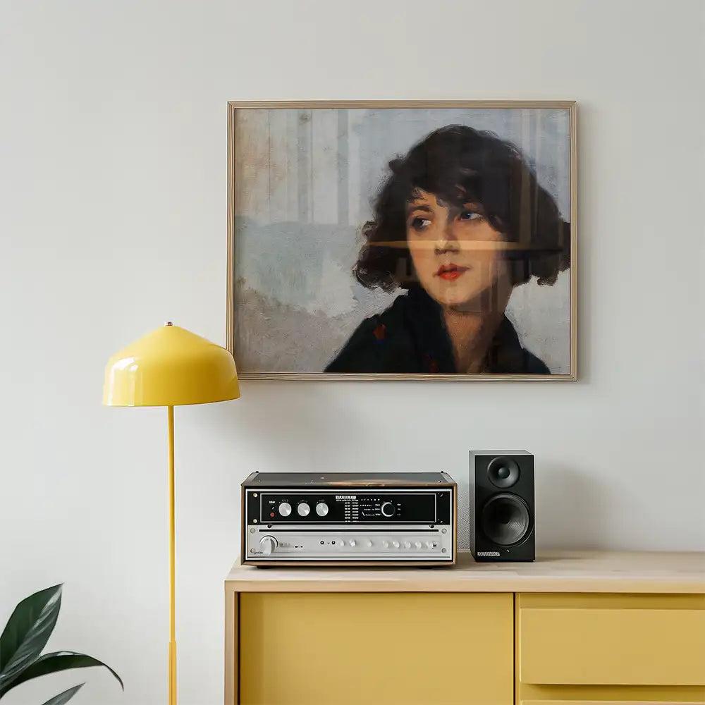 Painting of a woman with dark curly hair displayed above a vintage record player and next to a yellow lamp in a modern living room setting.