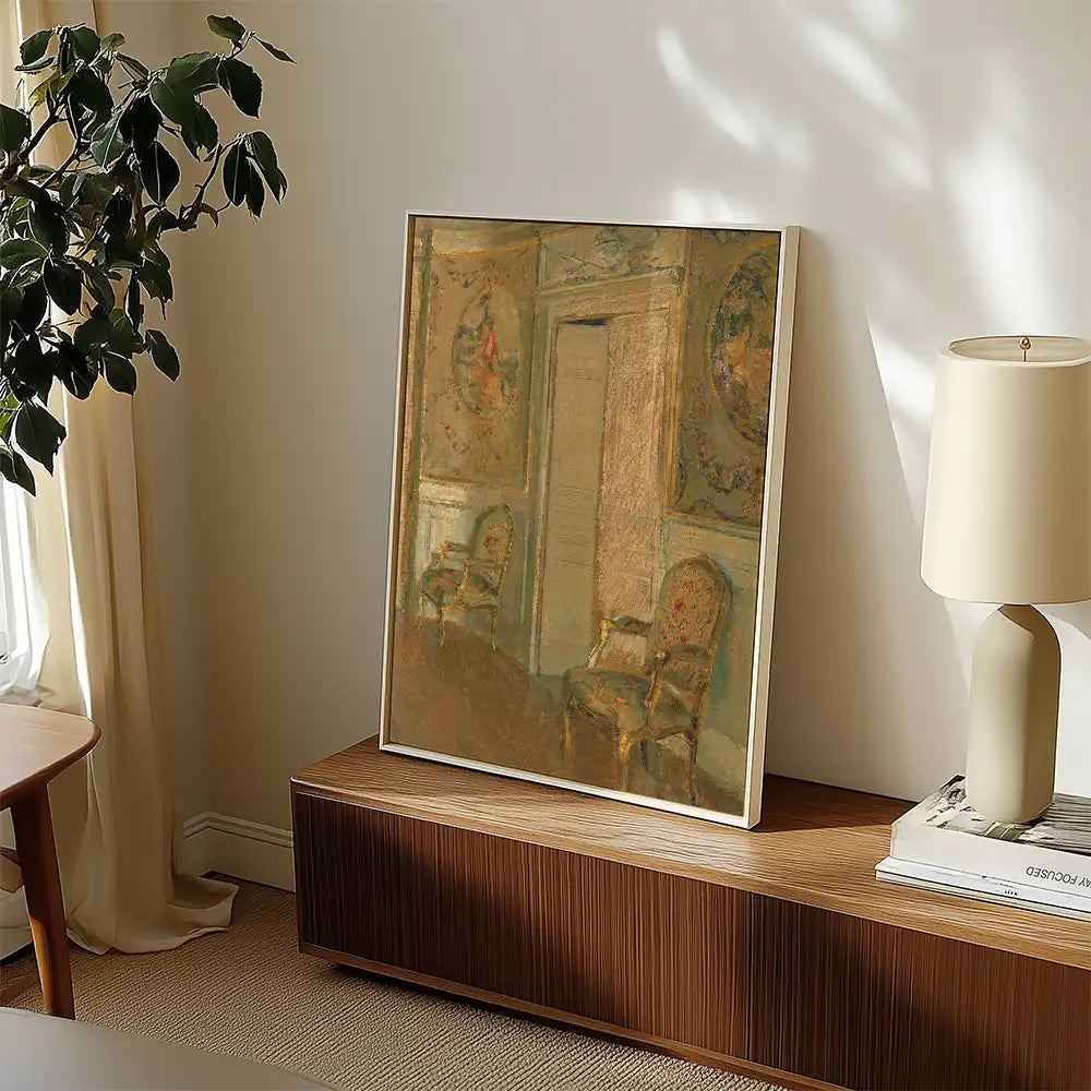 Painting displayed on a wooden console table with a lamp, surrounded by a plant and natural light.