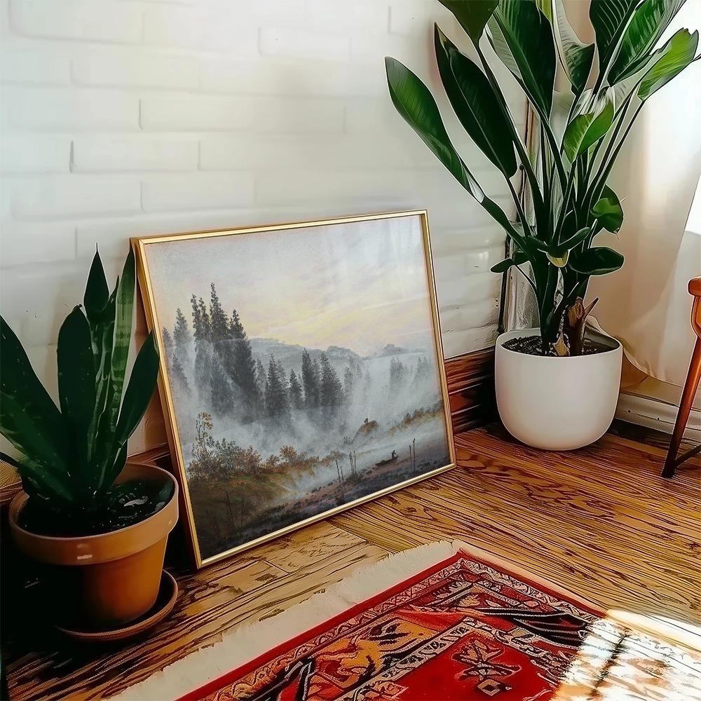 Framed landscape painting featuring misty mountains and forest, placed beside indoor plants in a cozy interior setting.