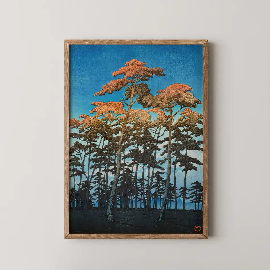 Framed painting of tall trees with orange foliage against a blue sky, showcasing a serene landscape.