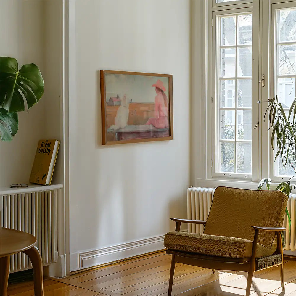 Modern reprint of a famous painting featuring a woman in a pink dress and hat sitting beside a white dog, elegantly displayed in a stylish living room setting.