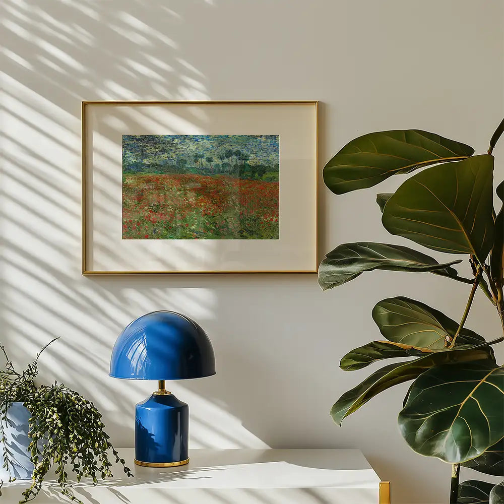 Framed colorful landscape painting displayed on a wall, accompanied by a blue lamp and green potted plant.