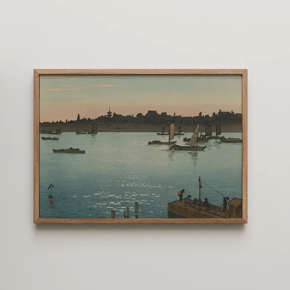 Framed painting of a serene waterfront scene with boats and a sunset in the background.