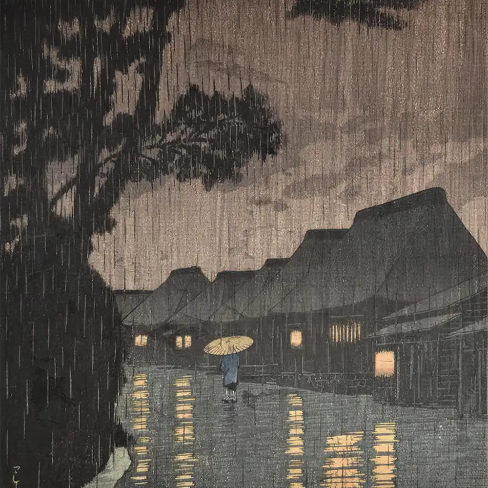 A serene nighttime scene depicting a figure with an umbrella walking along a rain-soaked street, illuminated by warm light from nearby houses, surrounded by dark trees and a moody sky.