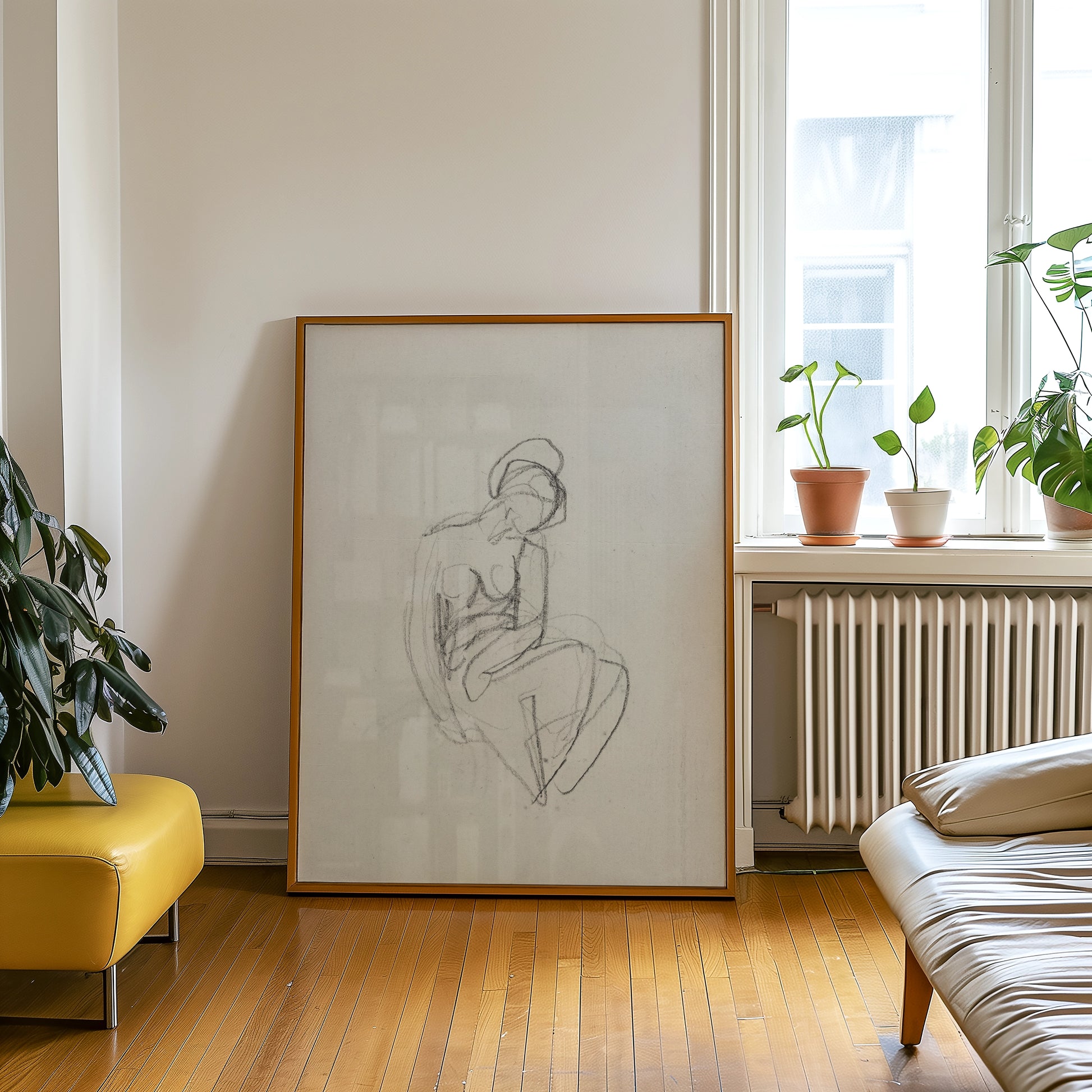 Abstract drawing of a seated figure in a wooden frame, displayed in a cozy living room setting with plants and modern furniture.