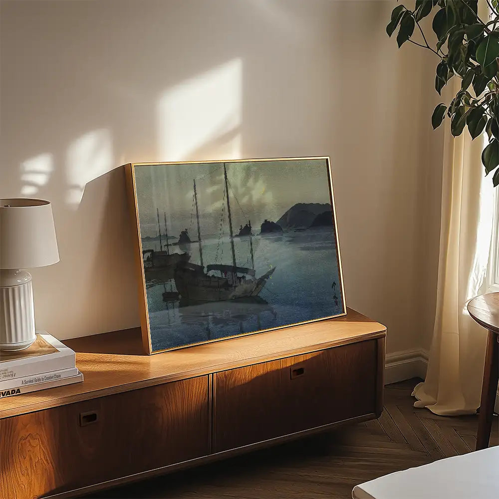 A serene watercolor painting of fishing boats in a tranquil sea, framed and displayed in a cozy living room setting.