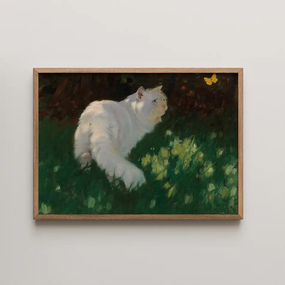 Painting of a white cat gazing at a butterfly in a grassy field, framed in a wooden border.
