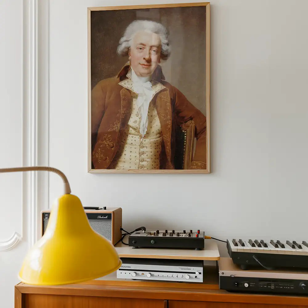 Framed portrait painting of a gentleman with white hair and a brown coat hanging on a wall above vintage audio equipment and a yellow lamp.