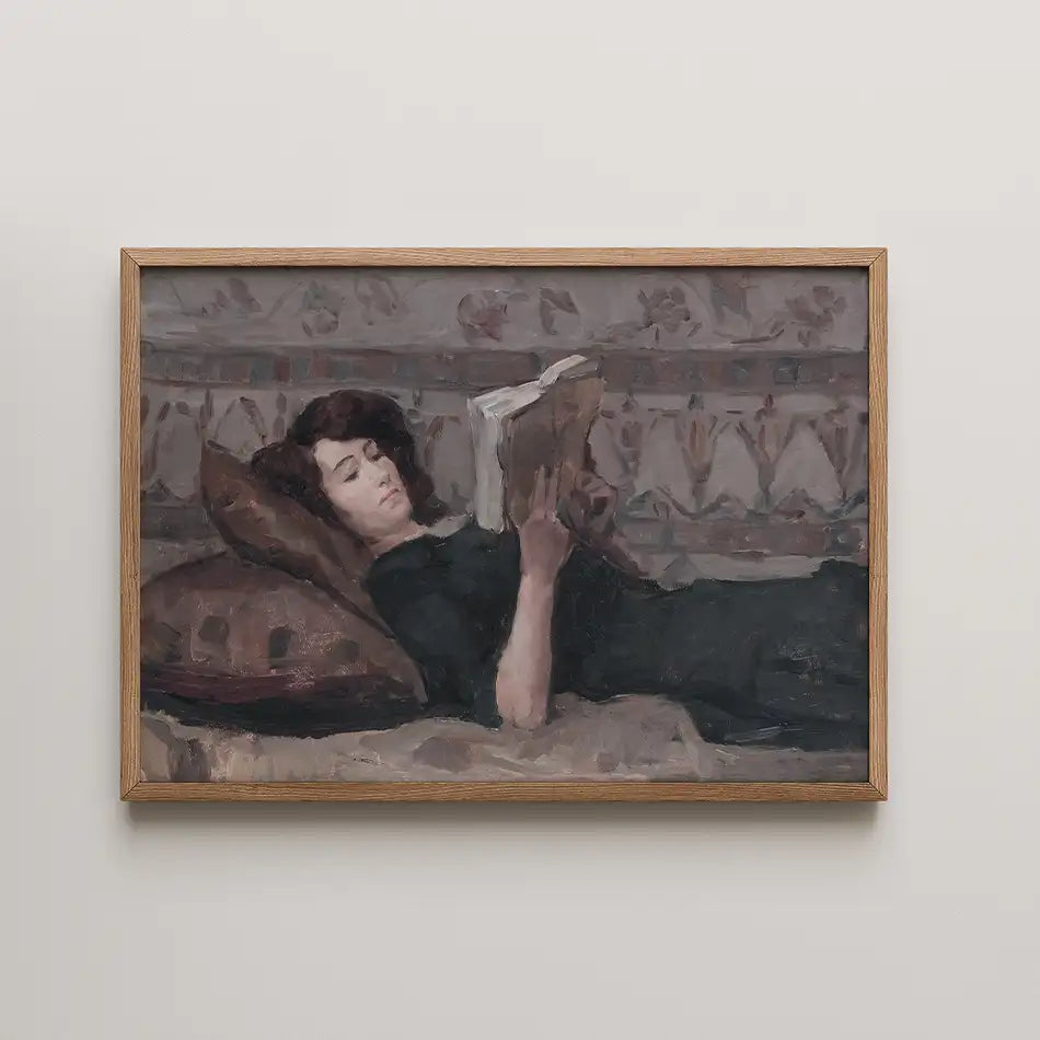 A woman reading a book while reclining on cushions in an elegant painting framed in wood.