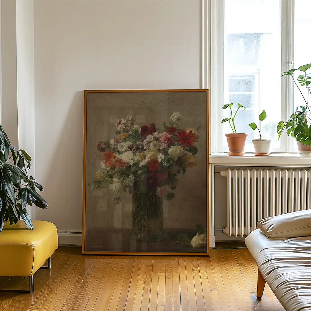 Framed painting of a colorful bouquet of flowers placed against a light wall in a modern living room setting with plants and furniture.