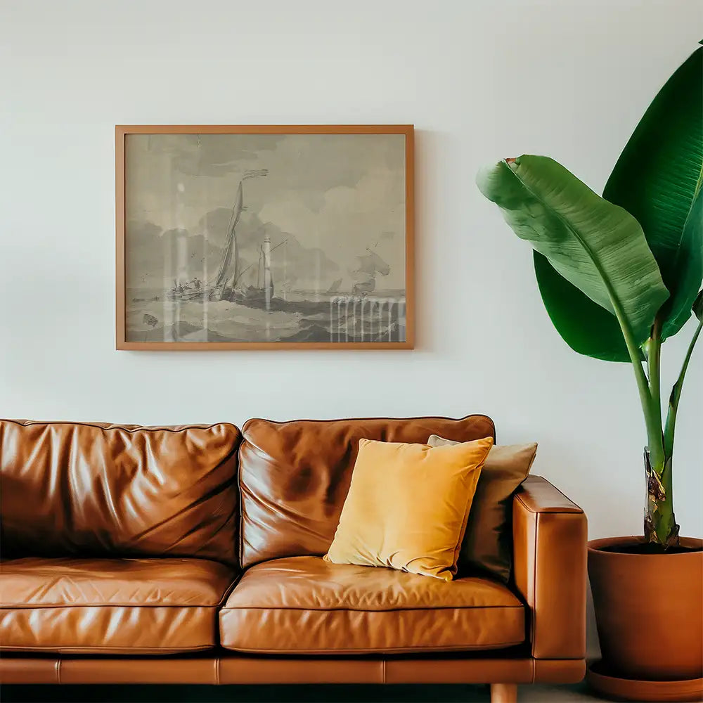 Framed vintage nautical painting above a brown leather couch with decorative yellow pillow and large green plant in a modern living room setting