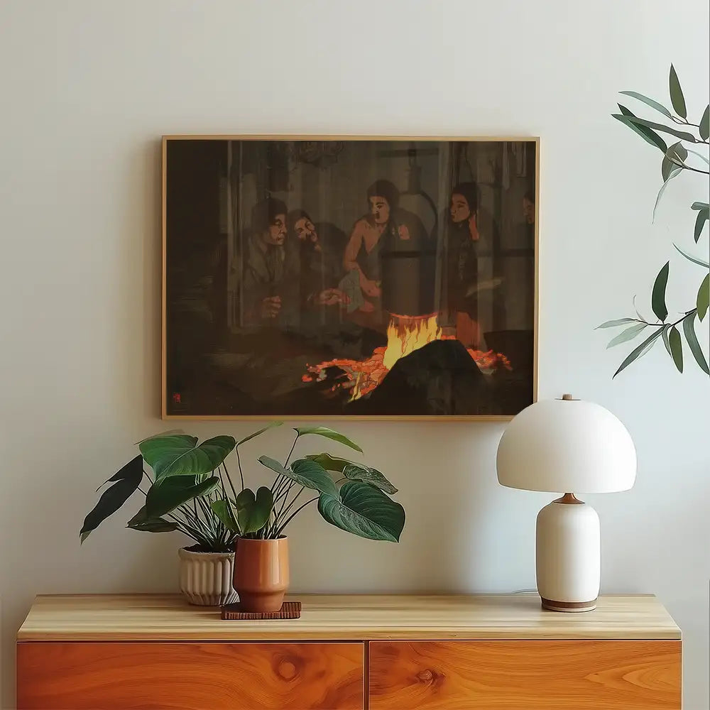 Painting of people gathered around a fire, framed and displayed on a wall above a wooden console table with plants and a lamp.