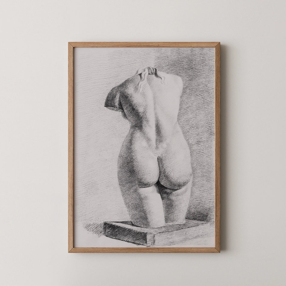 Black and white drawing of a female torso in a wooden frame on a white wall