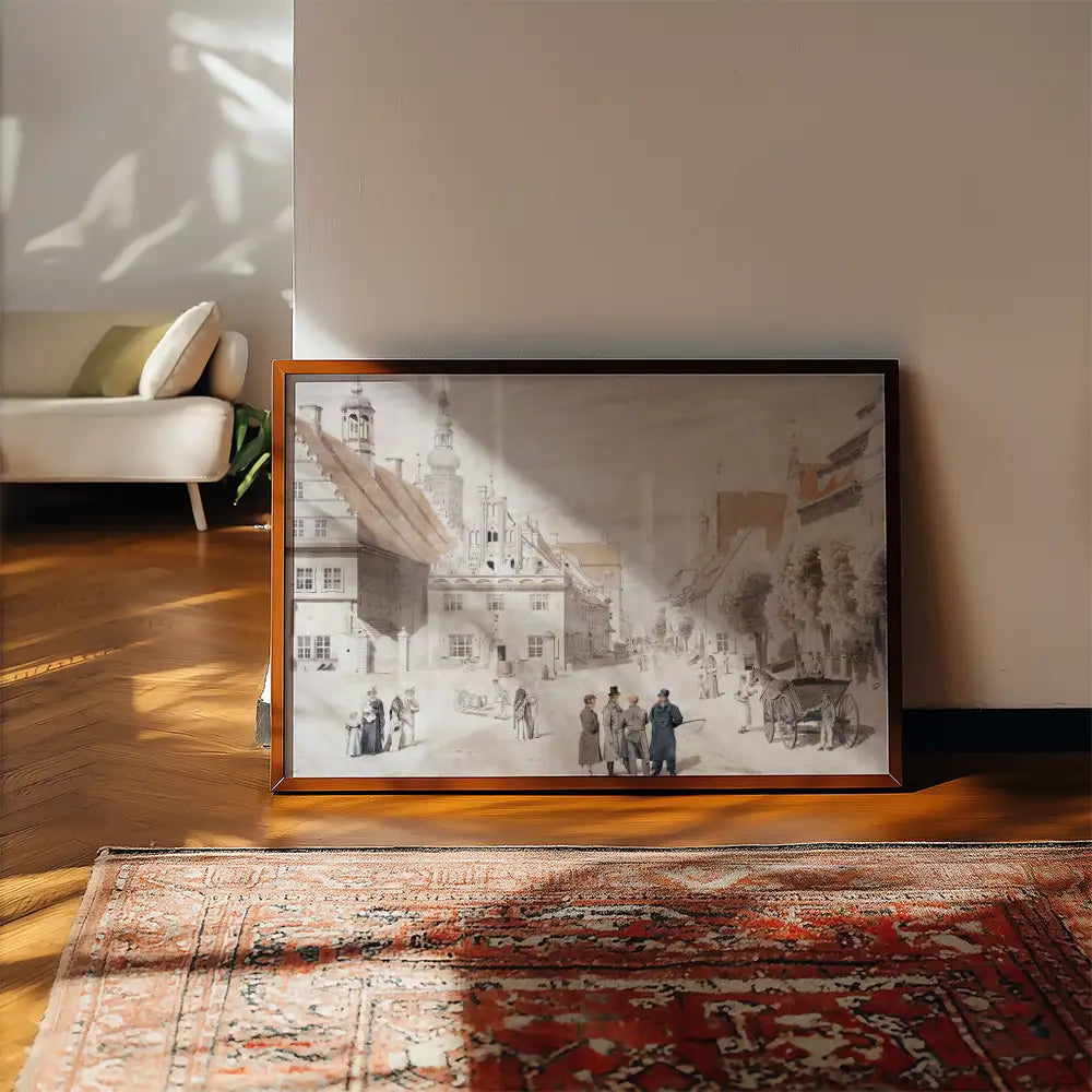 Framed vintage street scene painting leaning against a wall in a cozy interior with warm wood flooring and a decorative rug.