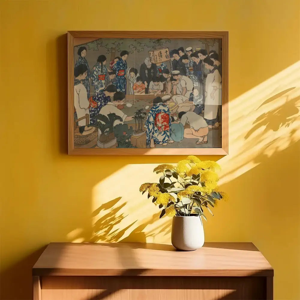 Painting in a wooden frame depicting a gathering of people in traditional clothing, displayed against a yellow wall with a vase of yellow flowers on a wooden table.