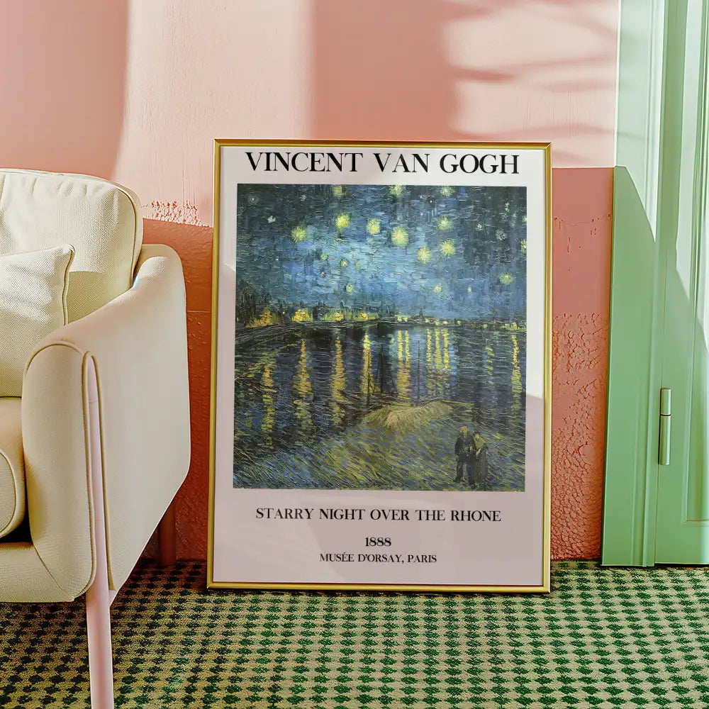 Vincent van Gogh's "Starry Night Over the Rhône" poster framed, displayed in a cozy interior setting with a pink wall and green door.
