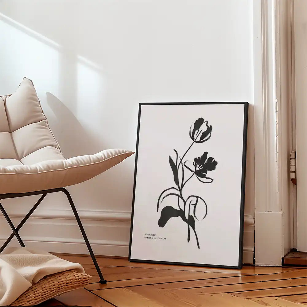 Modern black and white flower poster art print in a minimalist frame, displayed in a contemporary interior setting.