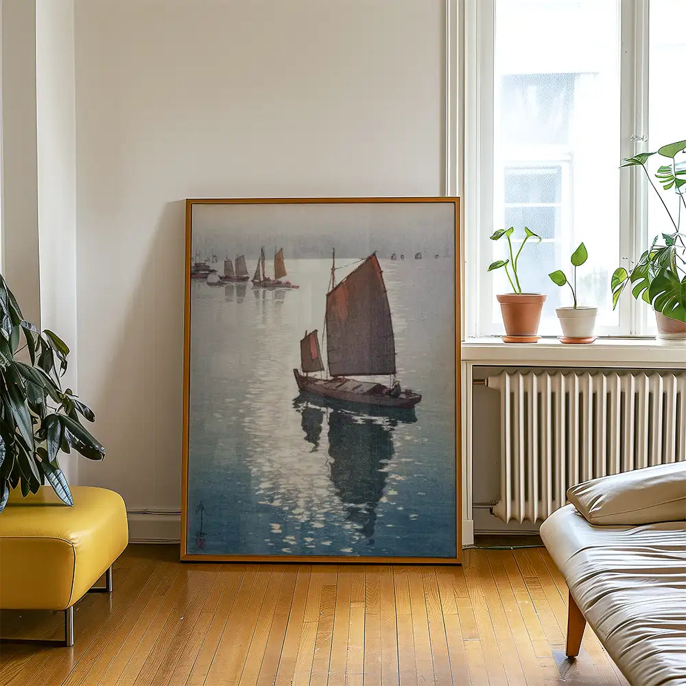 Oil painting of sailboats on calm water, framed and displayed in a modern living room setting.