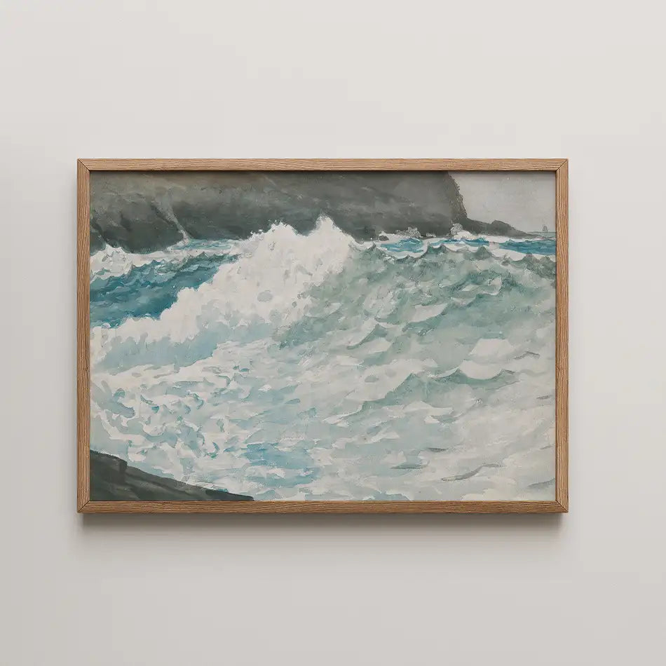 Painting of ocean waves in blue and white with dark rocky coastline, framed in light wood.