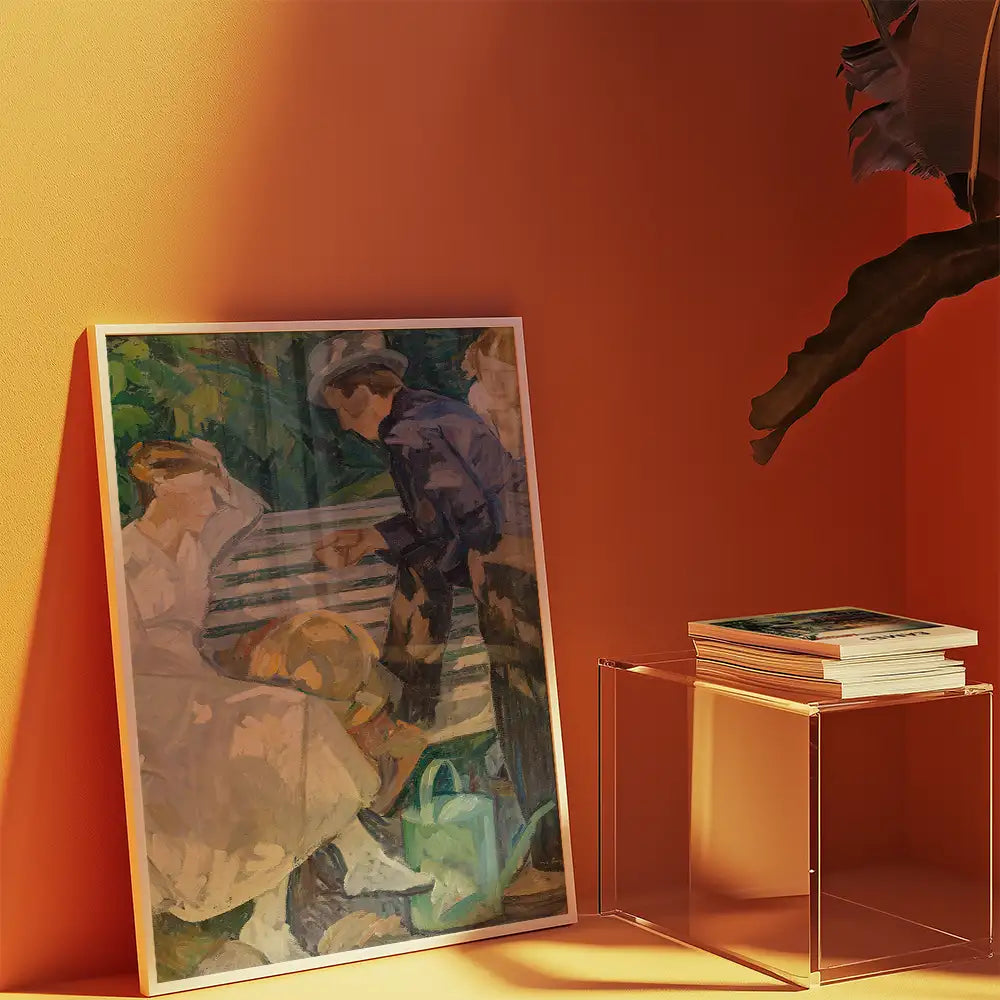 Painting displayed against an orange wall, featuring a scene of two people sitting on a bench with a third person interacting with them. A stack of books and a transparent table are positioned nearby.