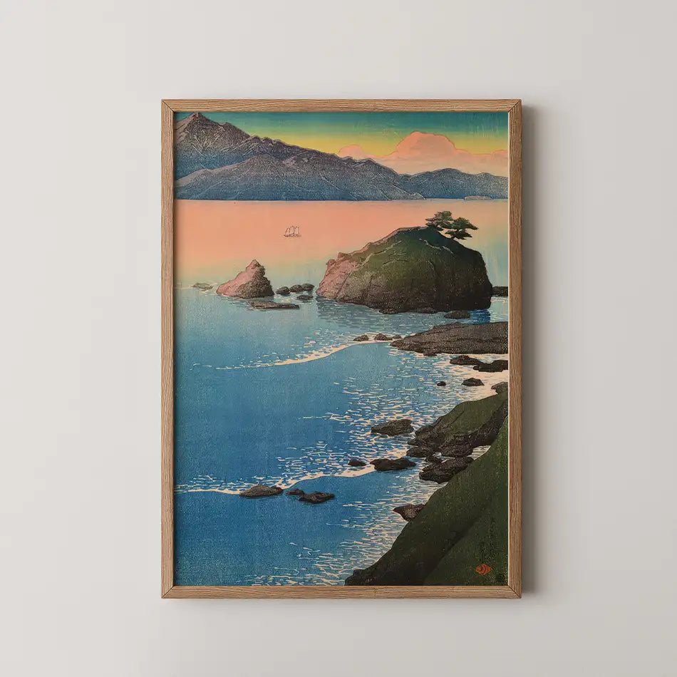 Framed painting of a serene coastal landscape featuring rocky islands, calm blue waters, and a pastel sky at sunset.