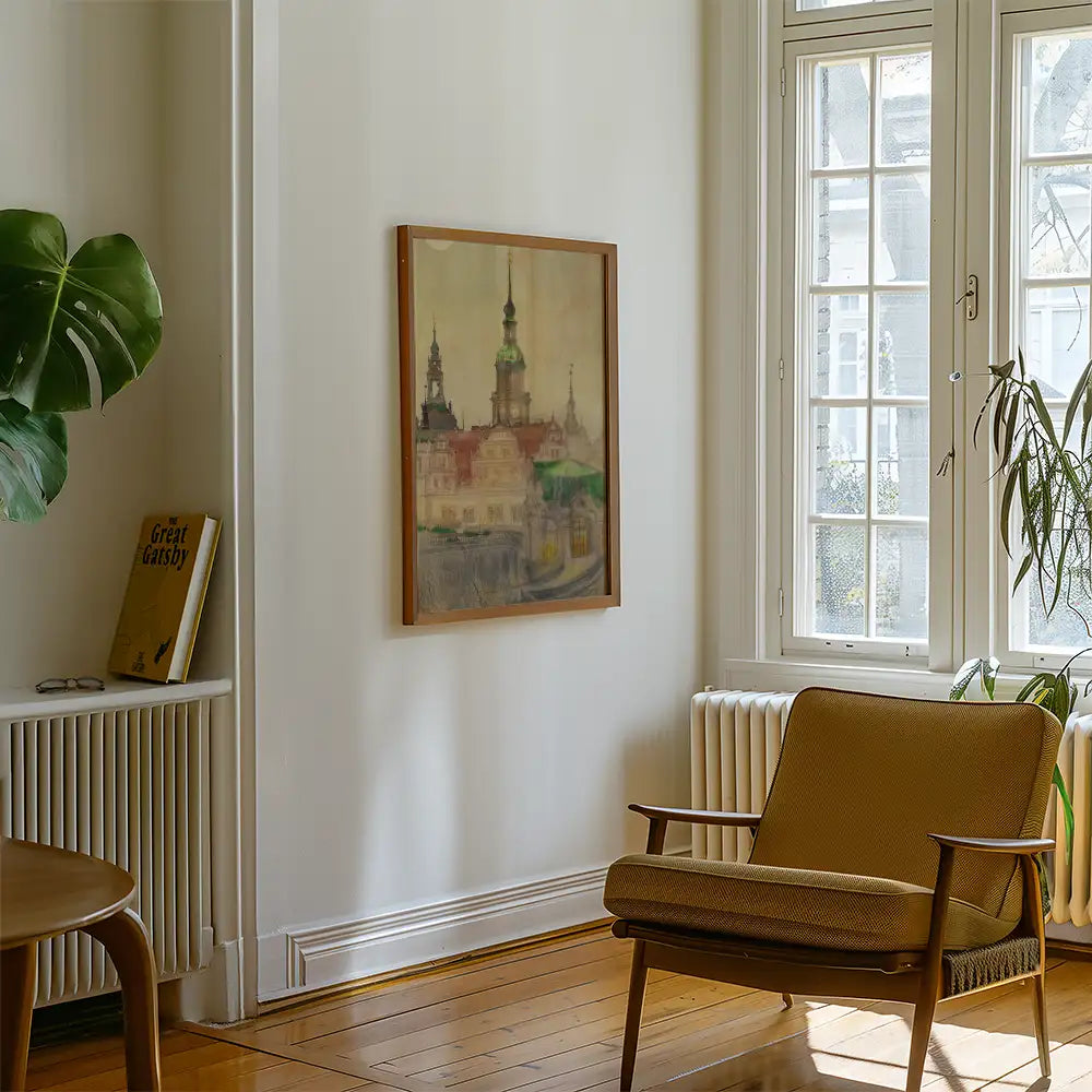 Painting of a cityscape framed on a wall in a bright, modern living room with a chair and a potted plant.
