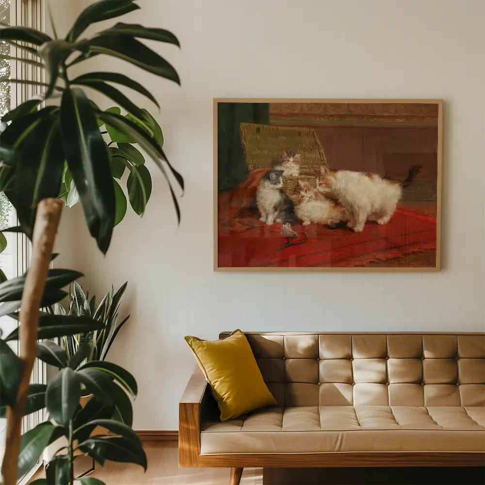 Painting of playful cats on a red rug, framed and displayed above a modern brown sofa with a yellow cushion, surrounded by indoor plants.