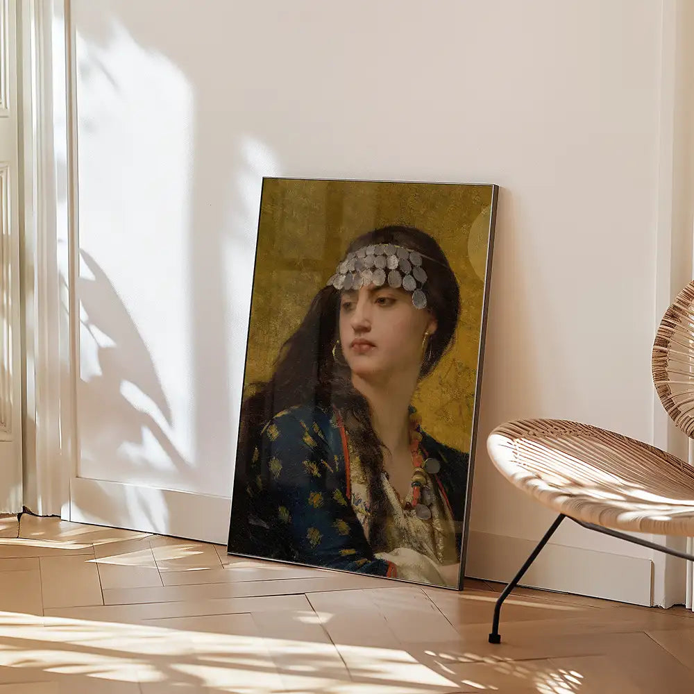 Framed portrait painting of a woman with a decorative headpiece, leaning against a wall in a stylish setting.
