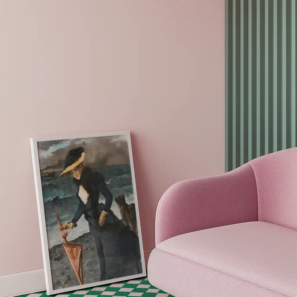 Painting of a woman holding an umbrella, set against a stormy ocean background, displayed next to a pink sofa in a contemporary interior.