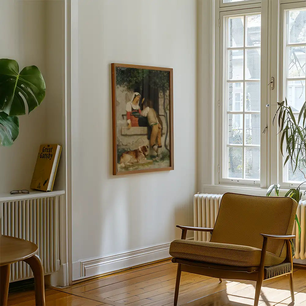 Framed painting of a woman and a man sitting together in a garden setting, with a dog lying on the ground, displayed in a cozy living room with a chair and natural light.