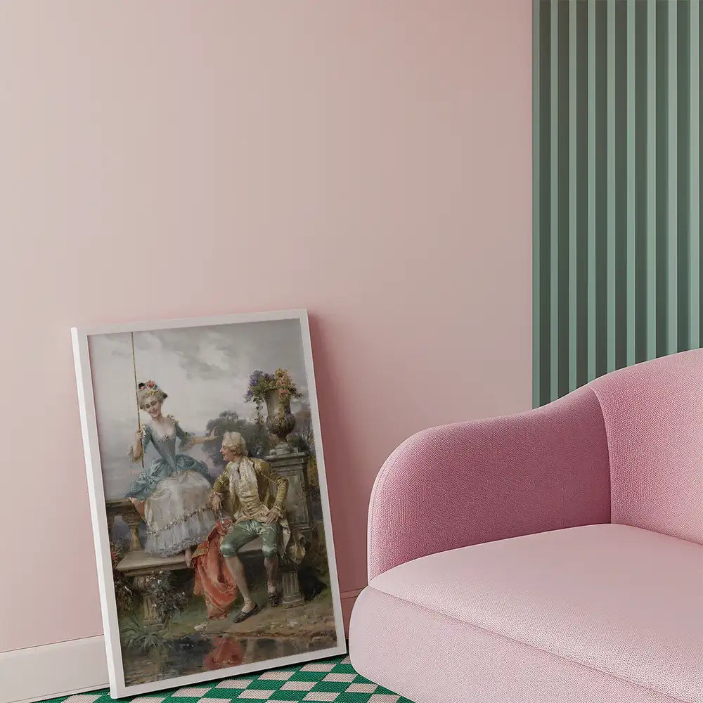 Framed painting of a woman on a swing and a man seated beside her, displayed in a modern living room with pink walls and a pink sofa.