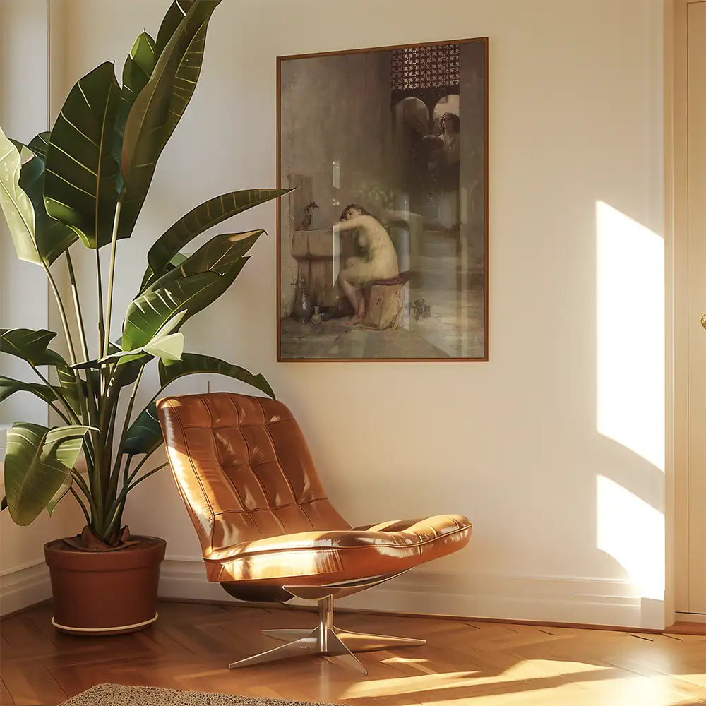Painting displayed on a wall in a bright room featuring a brown leather chair and a large green plant in a planter.