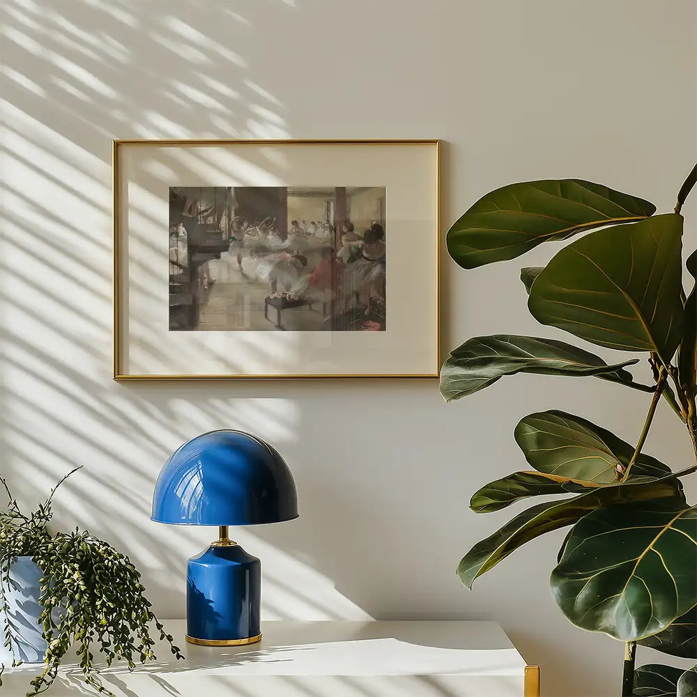 Framed painting hanging on a wall, featuring a serene scene, accompanied by a blue decorative lamp and a green potted plant on a white table.