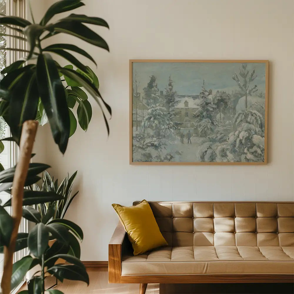 A framed winter landscape painting depicting a snowy scene with trees and two figures, hung on a light wall above a brown tufted sofa with a yellow cushion.