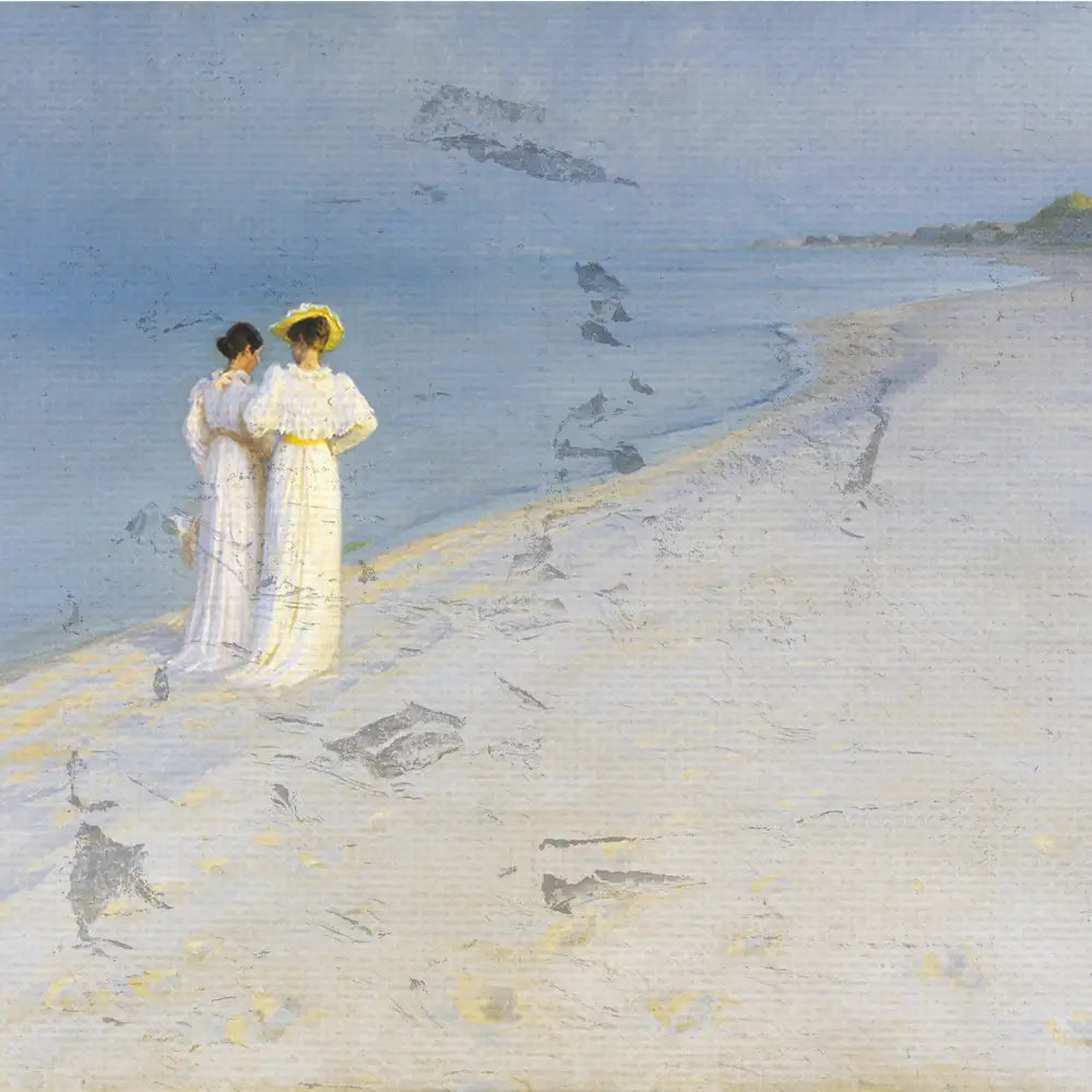 Two women in white dresses stand on a sandy beach, overlooking a calm ocean under a pale sky.