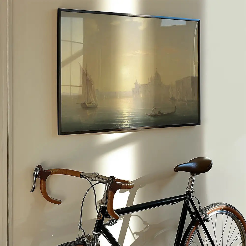 Painting depicting a serene waterfront scene with sailboats, displayed on a wall next to a bicycle.