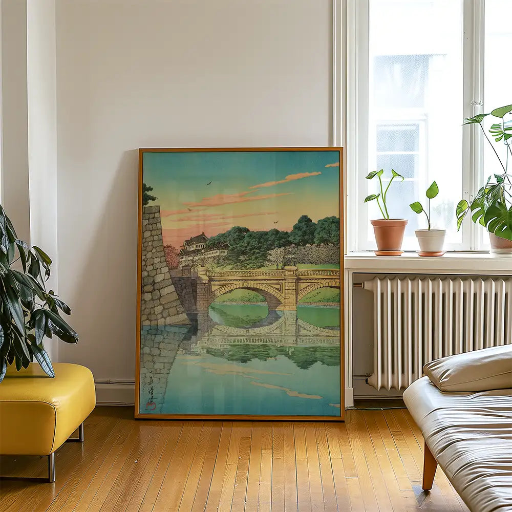 A vibrant painting of a bridge at sunset, displayed in a living room with plants and contemporary furniture.