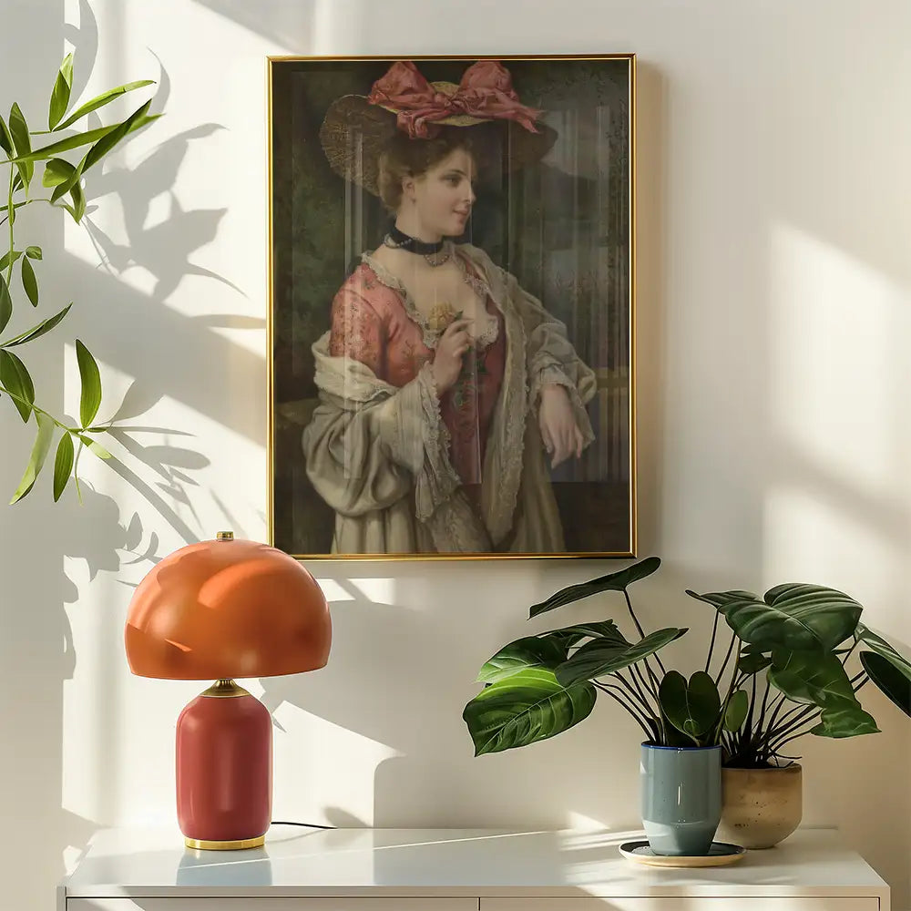 Framed vintage painting of a woman in historical attire, displayed in a bright room with a stylish lamp and potted plants.