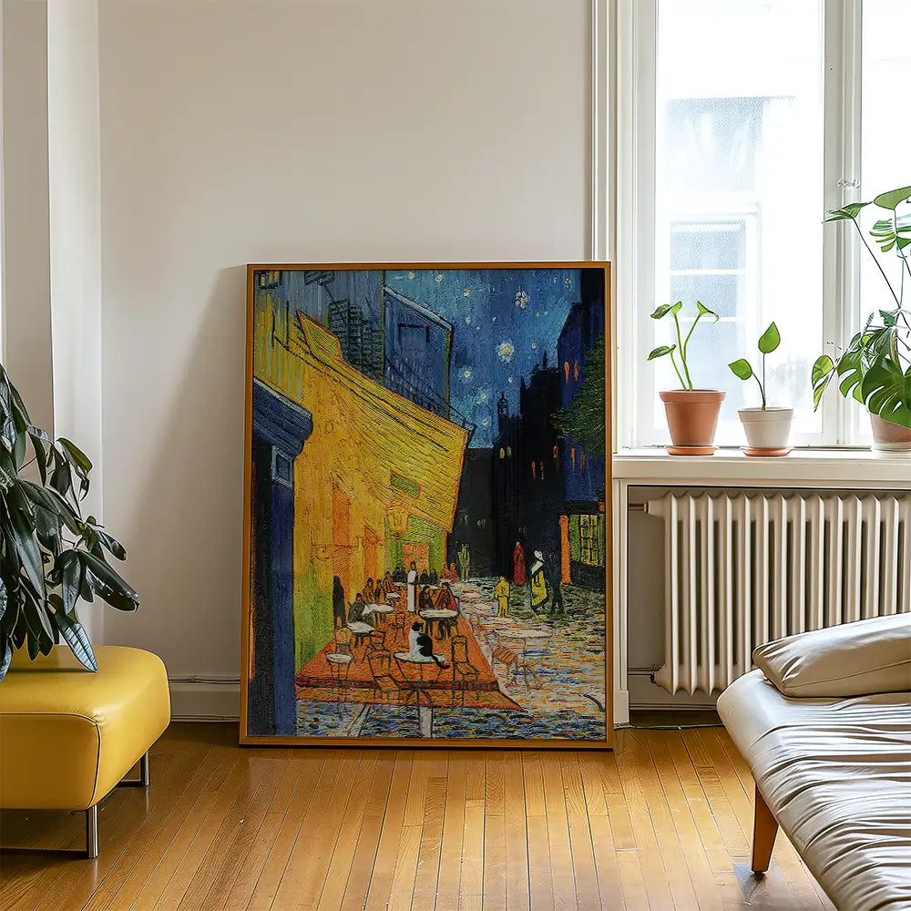 Painting of a vibrant café scene at night, featuring tables and people, with a starry sky backdrop, framed and displayed in a modern living room setting.