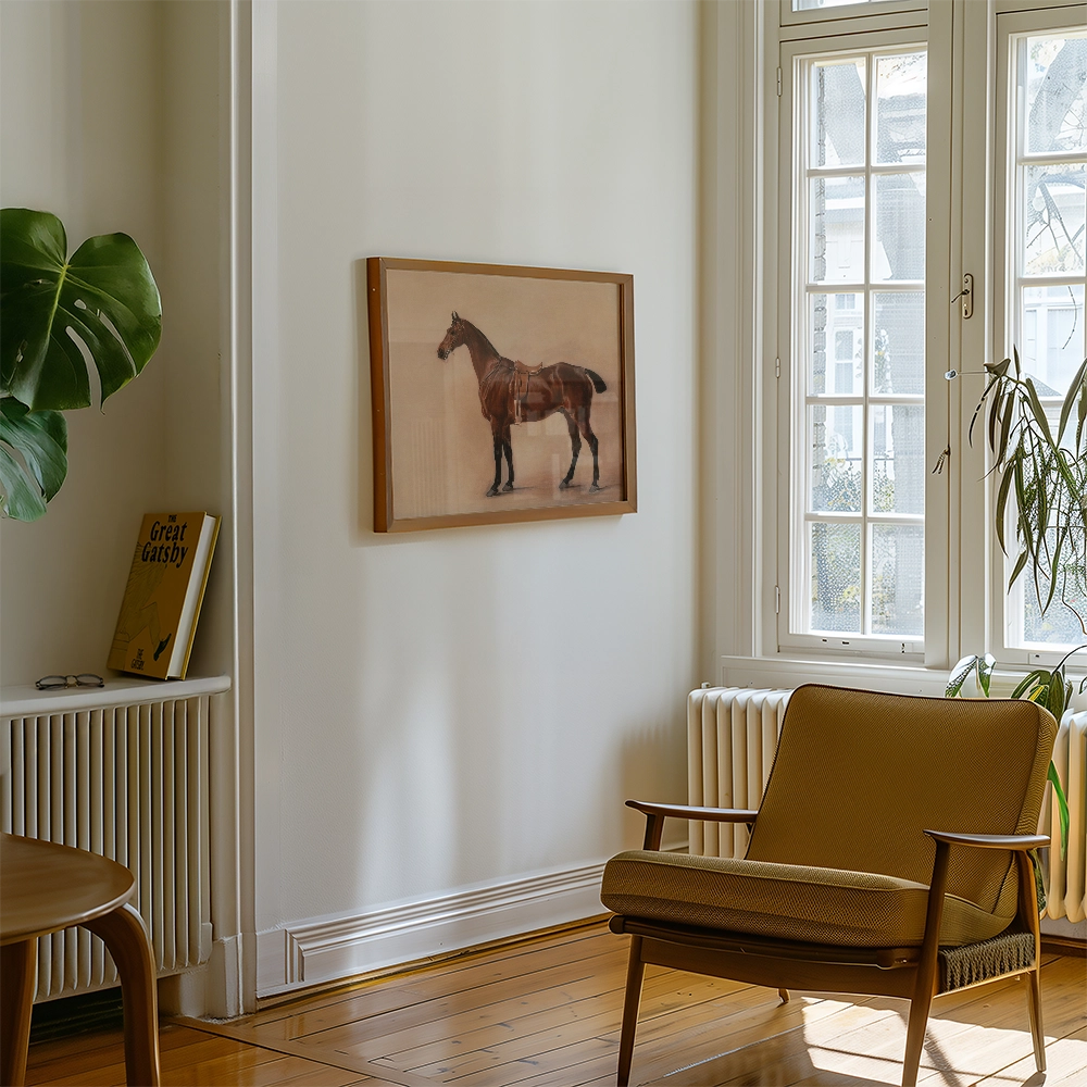Framed painting of a horse hanging on a white wall in a stylish interior with a brown chair and indoor plants.