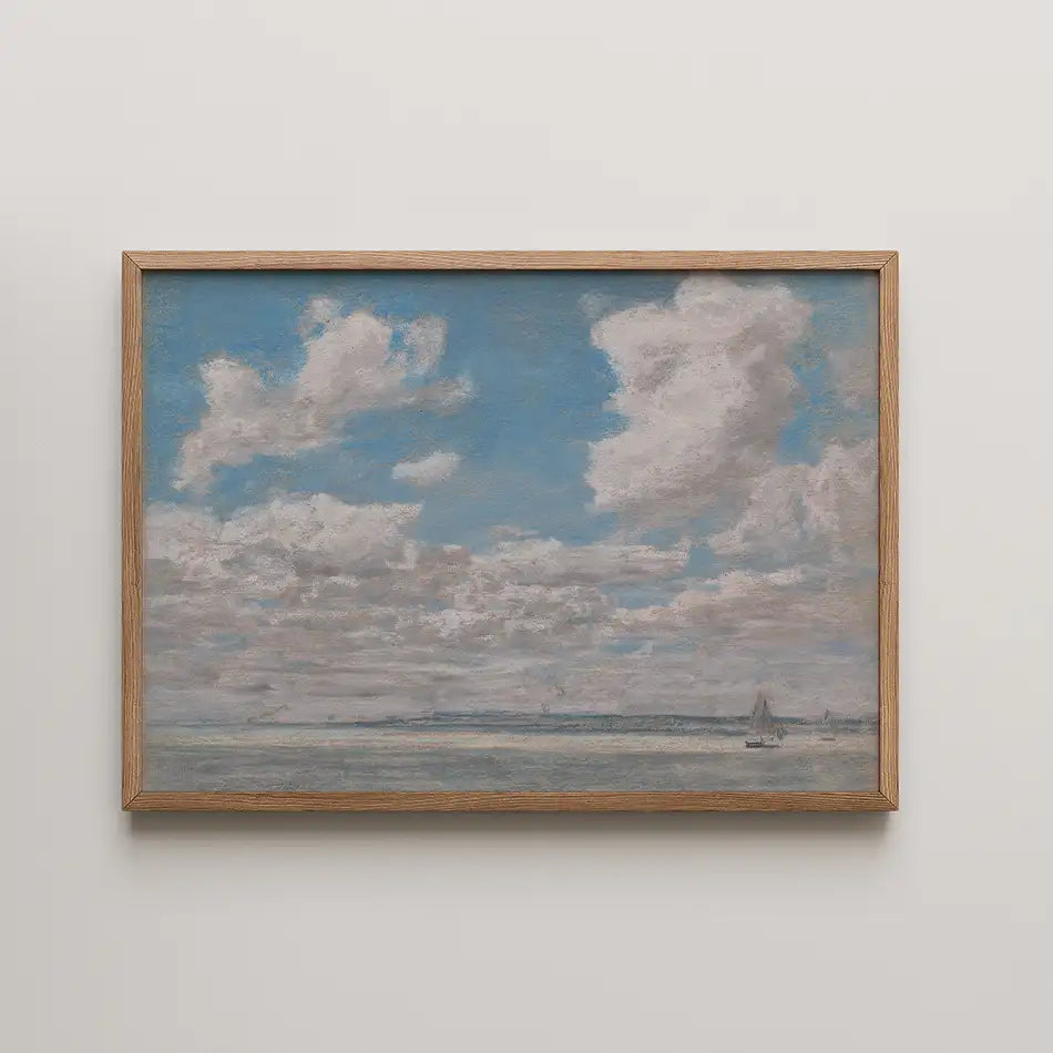 Painting of a serene sky with fluffy clouds over a calm sea, framed in natural wood.