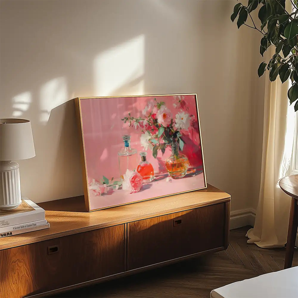 Still life painting featuring colorful perfume bottles and flowers, displayed on a wooden table in a bright room.