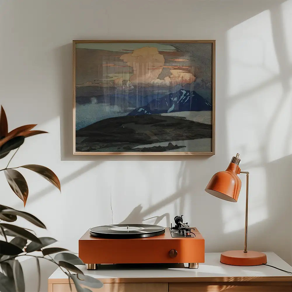 Abstract landscape painting in a gold frame above a stylish orange turntable and lamp in a modern interior.