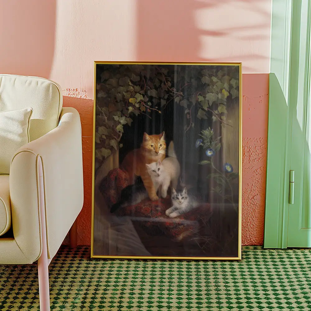 Painting of two cats, one orange and one white, among greenery, displayed in a stylish interior setting with a light-colored couch and patterned rug.