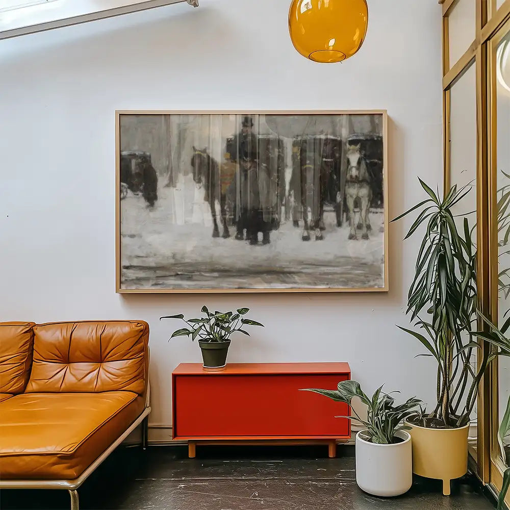 Painting of horses and figures in a snowy landscape displayed in a modern living space with an orange sofa and green plants.