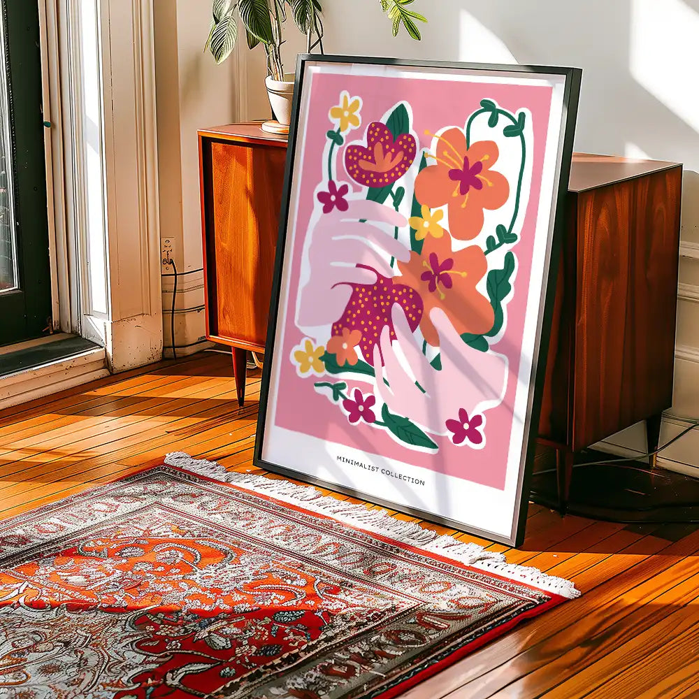 Modern minimalist poster featuring colorful hands holding flowers, displayed in a bright interior setting with wooden furniture and a decorative rug.