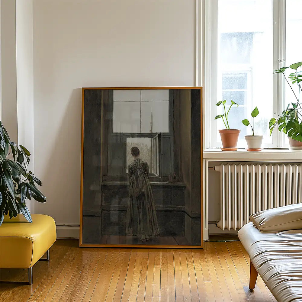 Painting of a woman looking out of a window, framed and displayed in a contemporary living room setting with plants and modern furniture.