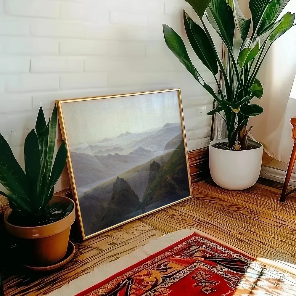 Framed landscape painting leaning against a wall, surrounded by indoor plants and a traditional rug.